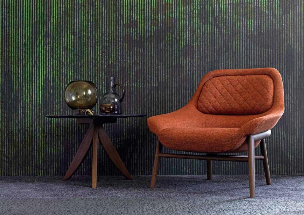 BertO furnishing accessories: Hanna armchair in orange fabric and round Circus coffee table.